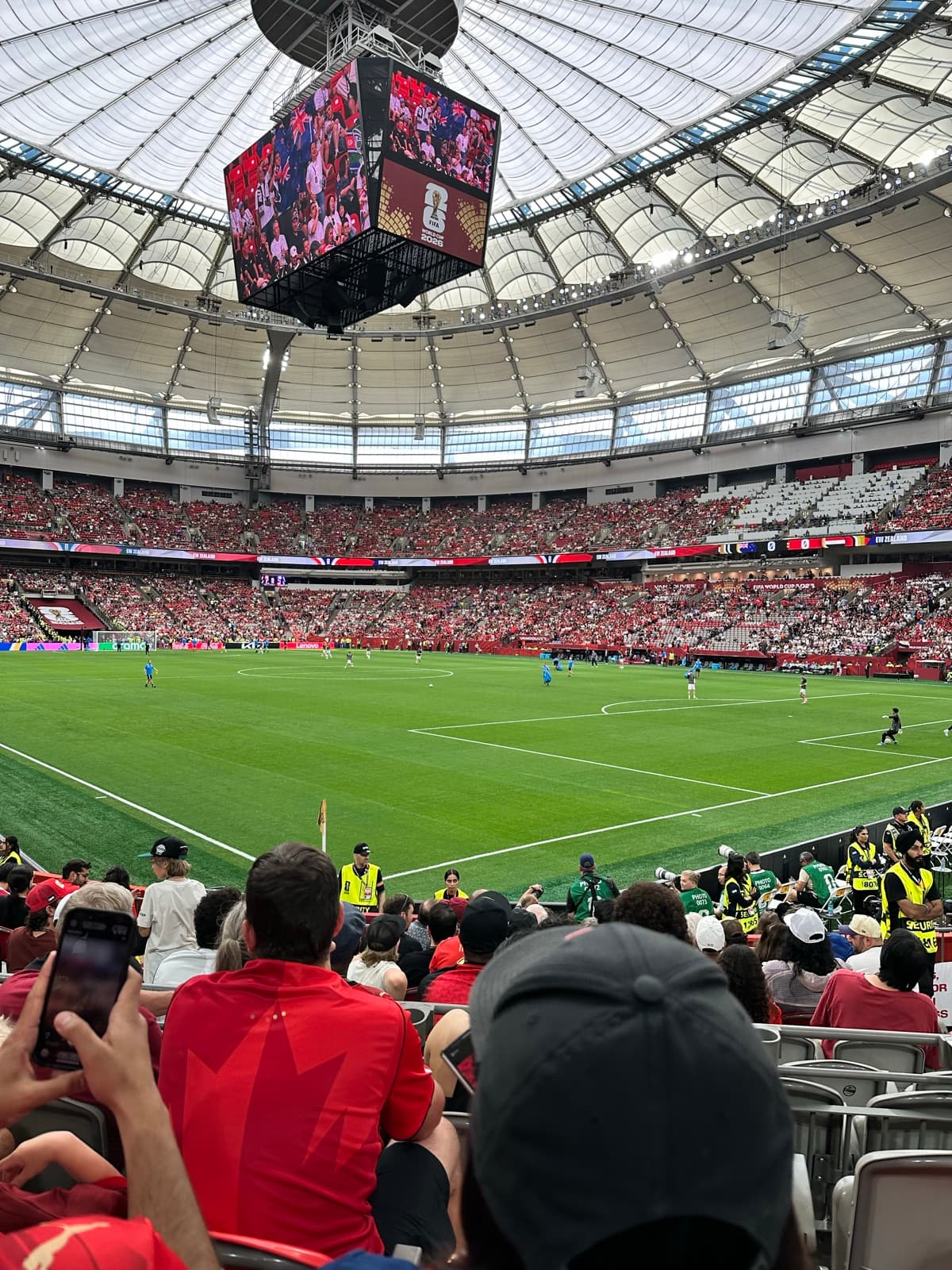 Packed, colourful stands during the match